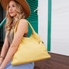 Woman Posing With The Pastel Yellow Large Leather Shoulder Bag