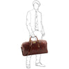 Man Posing With The Brown Leather Overnight Bag