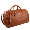 Angled View Of The Travel Bag Of The Honey Leather Duffle Bag Large And Travel Toiletry Bag