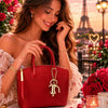 Model enjoying a Tote Leather Handbag in front of the Eiffel Tower, surrounded by roses in a romantic setting.