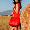 Over The Shoulder View Of A Woman With The Red Soft Leather Bag
