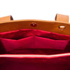 Interior view of Leather Shoulder Bag and Zip Around Wallet Set showcasing the spacious red lining and pockets.