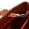 Interior view of the Leather Shoulder Bag featuring gold-tone hardware and red lining, showcasing the Leather Shoulder Bag and Zip Around Wallet Set.