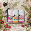 Handkerchief Ladies Gift Tin featuring three handkerchiefs with black cats and floral designs, surrounded by strawberries and cats.
