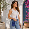 Woman wearing a stylish Cellphone Holder And Mini Crossbody Bag, standing outdoors with flowers.