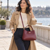 Woman Walking By The Water With The Bordeaux Italian Leather Bag