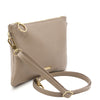 Angled And Shoulder Strap View Of The Light Taupe Clutch