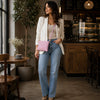 Woman Wearing The Ballet Pink Clutch  As A Crossbody Bag