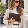Woman Holding The Chocolate Clutch