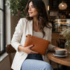 Woman Holding The Cognac Clutch