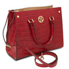 Angled And Shoulder Strap View Of The Red Croc Print Handbag
