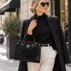 Woman Posing With The Black Croc Print Handbag