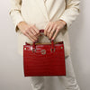 Woman Posing With The Red Croc Print Handbag
