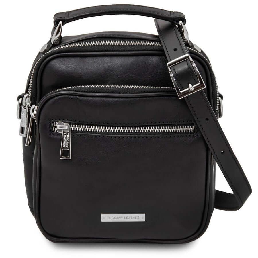 Man carrying a black leather crossbody bag during the sitewide Black Friday sale