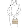 Woman Posing With The Beige Designer Handbag