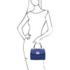 Woman Posing With The Blue Designer Handbag