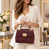 woman Holding The Bordeaux Designer Handbag
