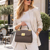 Woman In The Street Carrying The Dark Taupe Designer Handbag