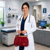 Doctor in a clinic holding a red Doctors Bag, showcasing timeless elegance and practical functionality.