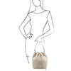 Woman Posing With The Beige Drawstring Bucket Bag