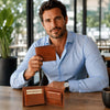 Man showcasing a Mens Leather Wallet made of premium Italian leather in a stylish indoor setting.