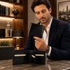 Man holding a Mens Leather Wallet Bifold, showcasing its interior compartments and card slots.