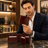 Man showcasing a Mens Leather Wallet Bifold made from premium Italian leather with card slots and ID window.