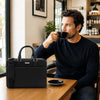 Man Sitting At A Table With The Black Executive Leather Bag
