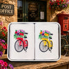 Hankies Floral Bikes featuring embroidered red and yellow bicycles with flowers in a decorative tin package.