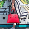 Woman Posing With The Lipstick Red Genuine Leather Handbag