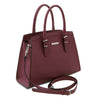 Angled And Shoulder Strap View Of The Bordeaux Genuine Leather Handbag