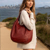 Woman Posing With The Red Gina Large Leather Hobo Bag