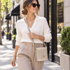 Woman In The Street Wearing The  Beige Italian Leather Crossbody Bag across her body