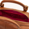 Close-up of the interior of a Cognac Italian leather duffle bag, showing a beige patterned lining, open pocket and gold-tone hardware.