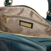 Close-up of a Teal Italian leather duffle bag interior with gold-tone hardware and zip closure