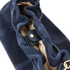 Magnetic Button Closure Side And Detachable Handle View Of The Dark Blue Italian Suede Drawstring Shoulder Bag