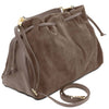 Angled And Shoulder Strap View Of The Dark Taupe Italian Suede Drawstring Shoulder Bag