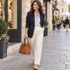 Woman In The Street Carrying The Cognac Italian Suede Leather Bucket Bag