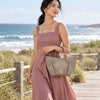 Woman By the Sea Carrying The Light Taupe Italian Handbag