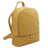 Angled View Of The Pastel Yellow Ladies Small Leather Backpack