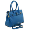 Angled and Shoulder Strap View Of The Blue Ladies Handbag