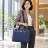 Elegant woman in business attire holding a Ladies Leather Business Bag, showcasing modern professionalism and style.