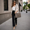 Over The Shoulder View Of The Woman Walking With The Dark Taupe Ladies Leather Business Bag