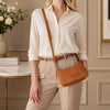 Leather Clutch Bag for Women worn with stylish outfit in elegant setting.