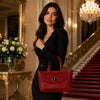 Elegant woman holding a Designer Leather Handbag in red, showcasing sophistication and practicality.