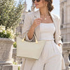 Woman In The Street Holding The Beige Ladies Leather Tote Handbag