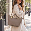 Woman in the street with the Taupe View Of The Taupe Ladies Leather Tote Handbag