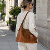 Woman Posing With The Coganc Ladies Pebbled Leather Hobo Bag