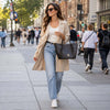 Woman Walking In The Street With The Chocolate Large Italian Handbag