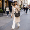 Woman In The Street With The Chocolate Large Italian Handbag Over Her Shoulder